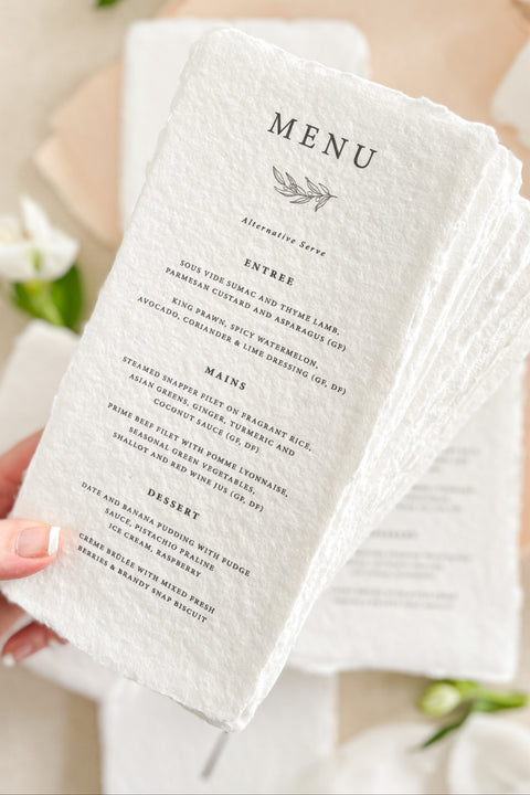Set the tone for your reception with our luxury handmade paper wedding menus, crafted from premium 100% cotton rag paper and finished with naturally torn deckled edges. Designed for couples who appreciate refined details and timeless artistry, each menu is hand-pressed and printed using archival inks to ensure every piece feels like a work of art. These menus can be fully customized with your menu wording, monogram, and ink color.