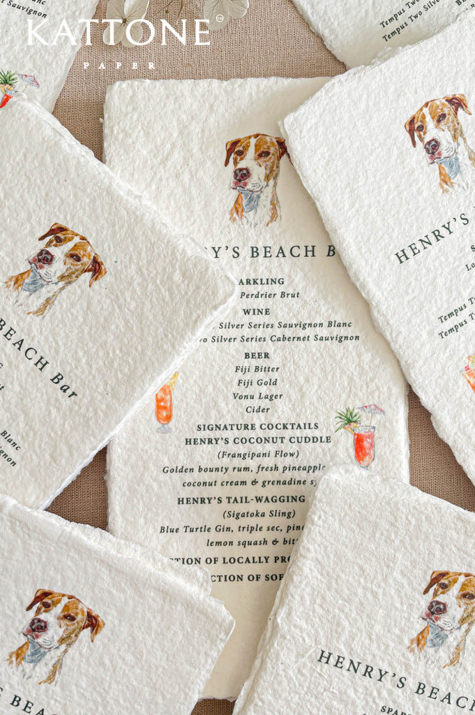 Handmade cotton paper with visible fibers and organically torn deckled edges emphasizing artisanal craftsmanship.