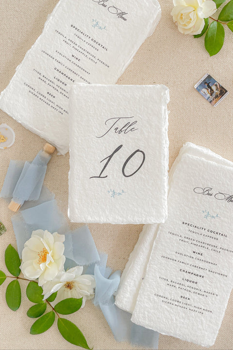 Add artisanal elegance to your wedding tables with our handmade paper wedding menus, crafted on luxurious cotton rag paper with naturally torn deckled edges. Each menu is printed with refined typography and delicate design elements, embodying the essence of fine-art minimalism. Perfect for romantic, garden, and destination weddings, these menus bring texture, warmth, and timeless sophistication to your reception setting.