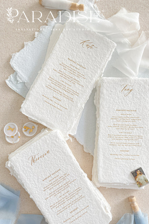 These handmade paper wedding menus embody effortless sophistication and artisanal beauty. Each piece is crafted from luxurious 100% cotton rag paper, featuring naturally deckled edges and a tactile texture that evokes fine art elegance. The menus are adorned with gold calligraphy-style text, creating a graceful contrast against the soft white handmade paper - a perfect fusion of classic romance and modern refinement.