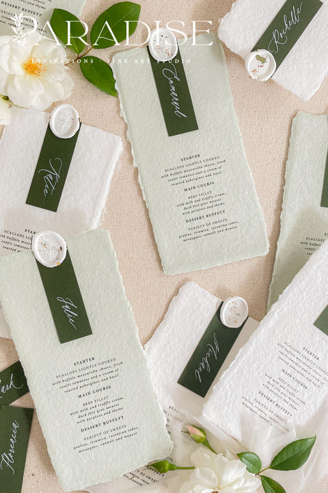 Add a refined botanical touch to your reception with our colored handmade paper wedding menus, crafted from 100% cotton rag paper and finished in a delicate sage green tone. Each menu features hand-torn deckled edges, elegant typography, and a deep green name tag topped with a custom wax seal, creating a luxurious and organic fine-art aesthetic. The soft, nature-inspired color palette perfectly complements garden, vineyard, or outdoor weddings.