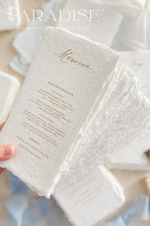 These handmade paper wedding menus embody effortless sophistication and artisanal beauty. Each piece is crafted from luxurious 100% cotton rag paper, featuring naturally deckled edges and a tactile texture that evokes fine art elegance. The menus are adorned with gold calligraphy-style text, creating a graceful contrast against the soft white handmade paper - a perfect fusion of classic romance and modern refinement.