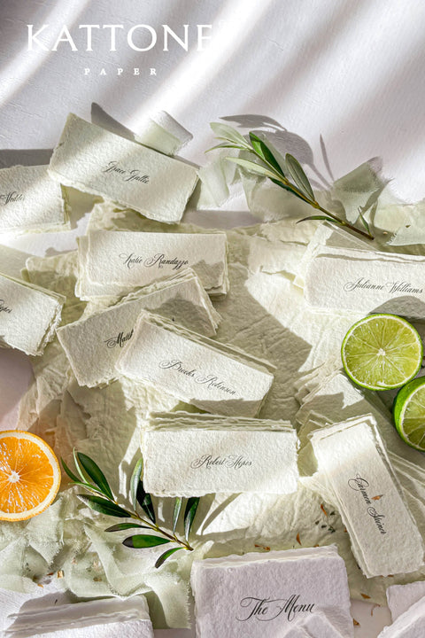 Bring artisanal beauty to your event with our handmade paper place cards, crafted from luxurious cotton rag paper and detailed with natural deckled edges. Each card features a pressed dried floral element sealed beneath a creamy wax stamp, creating a textured fine-art look perfect for garden weddings, outdoor celebrations, and romantic gatherings. These one-of-a-kind place cards add organic charm, timeless artistry, and meaningful detail to every tablescape.