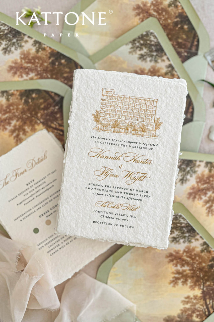 Close up of handmade cotton paper wedding invitation showing organic deckled edges and fine art texture.