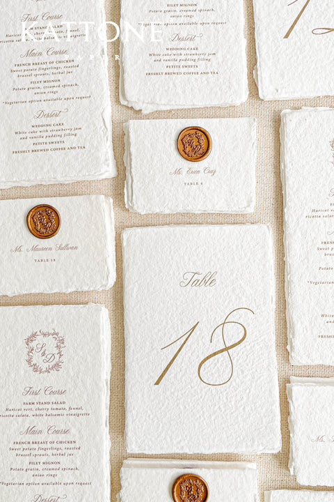 Add timeless elegance to your tablescape with our handmade paper wedding menus, beautifully crafted for refined, romantic celebrations. Each menu is made from luxurious 100% cotton rag paper, known for its soft deckled edges and natural texture that evokes fine art stationery. These menus feature delicate typography and a custom monogram crest, complemented by an optional wax seal accent that adds a regal, old-world charm.