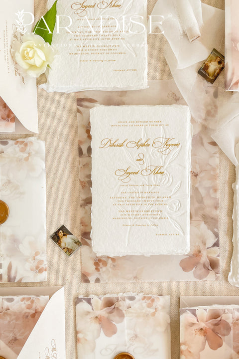 This exquisite wedding invites suite offers a blend of natural texture and romantic charm, perfect for an autumn wedding. Each piece is beautifully embossed with a delicate botanical design onto luxurious deckle edge cotton rag paper, providing a rich, tactile feel. The result is a truly romantic botanical wedding stationery set that captures the warm, earthy tones and intimate feel of the season.