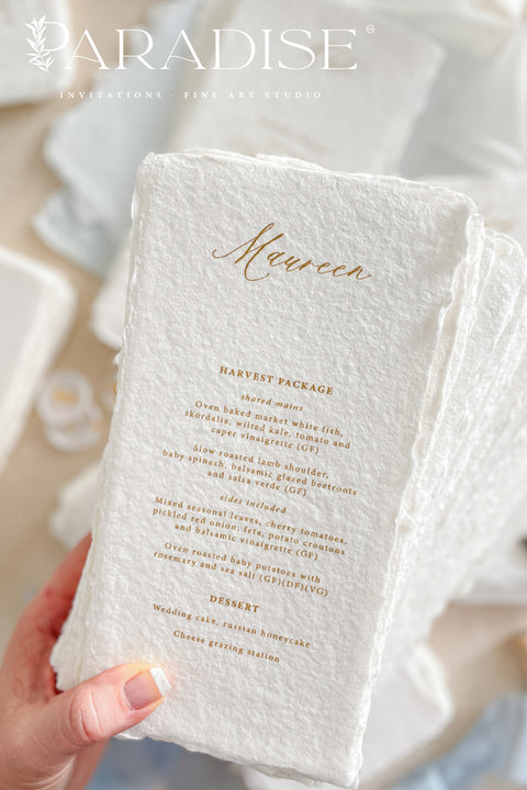 These handmade paper wedding menus embody effortless sophistication and artisanal beauty. Each piece is crafted from luxurious 100% cotton rag paper, featuring naturally deckled edges and a tactile texture that evokes fine art elegance. The menus are adorned with gold calligraphy-style text, creating a graceful contrast against the soft white handmade paper - a perfect fusion of classic romance and modern refinement.