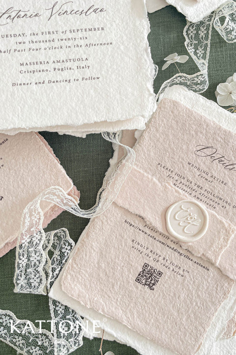 Close up of textured handmade cotton paper invitation highlighting deckled edges, fine architectural illustration and elegant typography.