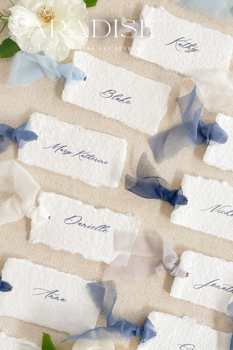 Add soft, romantic detailing to your tablescape with our silk ribbon handmade paper place cards, crafted from premium cotton rag paper and finished with naturally torn deckled edges. Each name tag is threaded with airy, hand-dyed silk ribbon and printed in elegant calligraphy, creating a luxurious fine-art look for weddings, rehearsal dinners, and intimate celebrations. These artisan-crafted cards bring movement, texture, and timeless beauty to your event design.