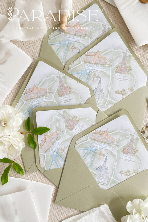 Elegant matcha green envelopes arranged with floral details for refined wedding invitations.