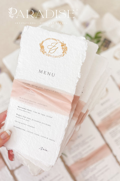 Add an air of refined romance to your wedding reception with our handmade paper wedding menus, beautifully adorned with a custom monogram and silk ribbon. Each menu is printed on luxurious 100% cotton rag paper with soft, torn deckled edges - a hallmark of artisanal craftsmanship. Designed for couples who value timeless design and tactile beauty, these menus feature elegant gold monograms paired with delicate blush silk ribbon wraps, creating a cohesive, fine art-inspired look.
