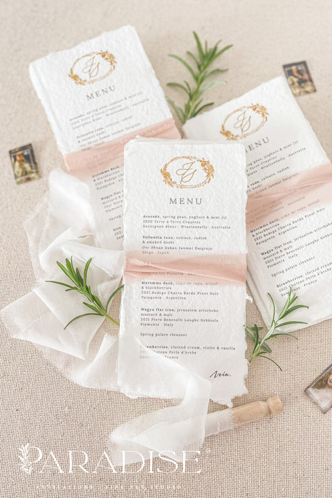 Add an air of refined romance to your wedding reception with our handmade paper wedding menus, beautifully adorned with a custom monogram and silk ribbon. Each menu is printed on luxurious 100% cotton rag paper with soft, torn deckled edges - a hallmark of artisanal craftsmanship. Designed for couples who value timeless design and tactile beauty, these menus feature elegant gold monograms paired with delicate blush silk ribbon wraps, creating a cohesive, fine art-inspired look.