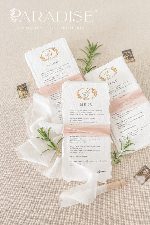 Add an air of refined romance to your wedding reception with our handmade paper wedding menus, beautifully adorned with a custom monogram and silk ribbon. Each menu is printed on luxurious 100% cotton rag paper with soft, torn deckled edges - a hallmark of artisanal craftsmanship. Designed for couples who value timeless design and tactile beauty, these menus feature elegant gold monograms paired with delicate blush silk ribbon wraps, creating a cohesive, fine art-inspired look.