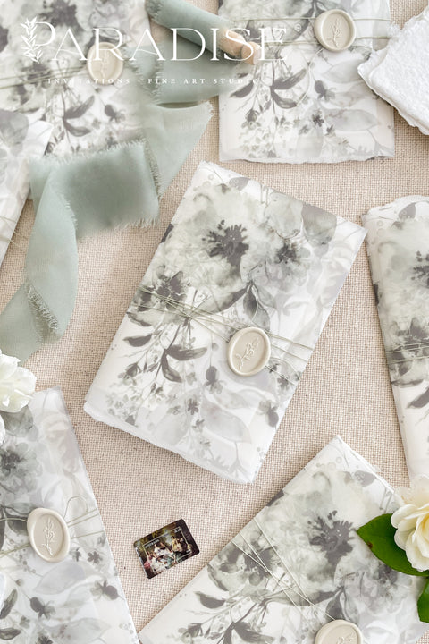 Our handmade wedding invitation suite features a custom hand-drawn monogram, printed on luxury deckled-edge cotton paper, and wrapped in translucent vellum jackets adorned with fine art floral illustrations. Each suite is finished with a silk ribbon and wax seal, blending old-world romance with modern artistry. Designed for couples who cherish attention to detail, this suite embodies elegance and craftsmanship - perfect for fine art, garden, or destination weddings.