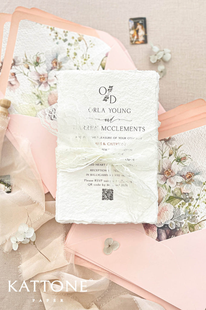 Complete luxury wedding invitation suite including handmade invitation, lace wrap, blush envelopes and botanical watercolor envelope liners.
