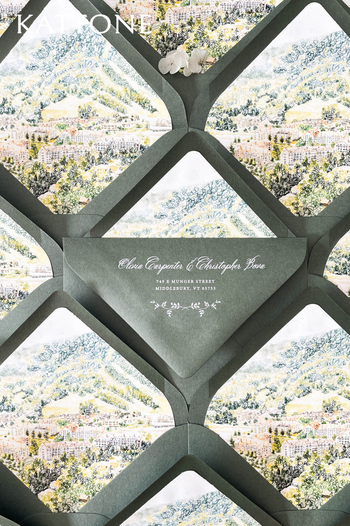 Custom wedding envelope liners with elegant watercolor landscape illustration featuring rolling hills, lush greenery, and countryside architecture.