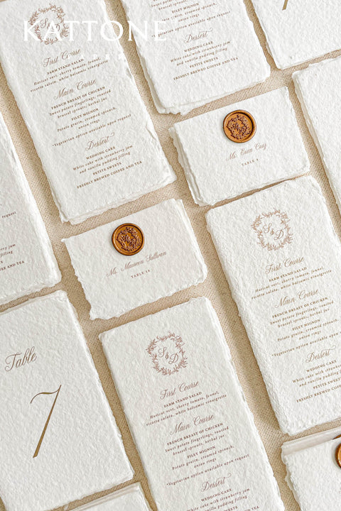 Crafted from premium handmade cotton paper with natural deckle edges, these table numbers bring refined elegance to any wedding tablescape. The flowing gold numeral design adds a touch of luxury, while the soft texture and artisanal character of the paper create a timeless, heirloom feel. Perfect for classic, romantic, and modern elegant celebrations, this piece blends practicality with the beauty of true craftsmanship.