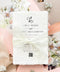 Luxury handmade cotton paper wedding invitation with deckled edges wrapped in ivory lace ribbon, styled with blush pink envelopes and watercolor floral envelope liners.