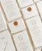 Add timeless elegance to your tablescape with our handmade paper wedding menus, beautifully crafted for refined, romantic celebrations. Each menu is made from luxurious 100% cotton rag paper, known for its soft deckled edges and natural texture that evokes fine art stationery. These menus feature delicate typography and a custom monogram crest, complemented by an optional wax seal accent that adds a regal, old-world charm.
