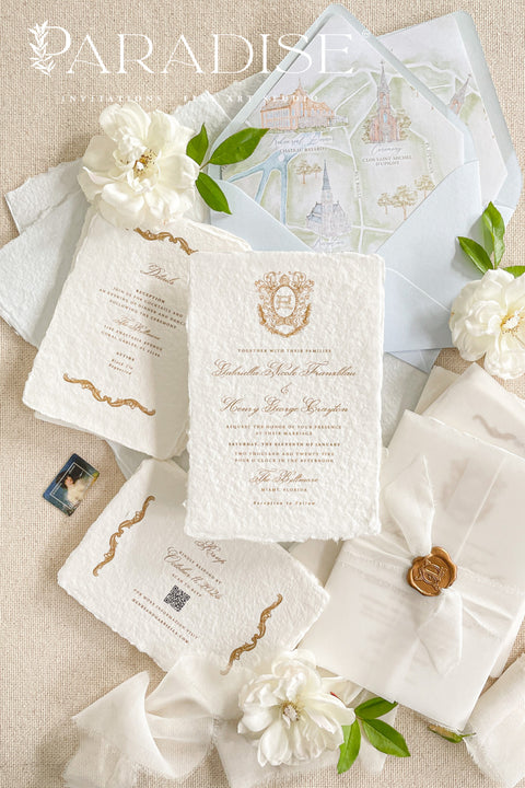 This exquisite wedding invitations suite offers a blend of vintage romance and personalized artistry. Each handmade paper invitation is a work of fine art, featuring a beautifully hand-painted custom vintage monogram and a unique watercolor map illustration. The result is a truly timeless and elegant suite that guides your guests through your wedding journey while providing a beautiful keepsake.