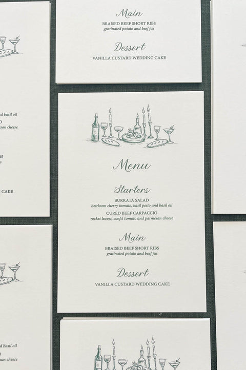 Elegant wedding menus printed on smooth cardstock with minimalist line art illustration and classic typography in neutral tones.