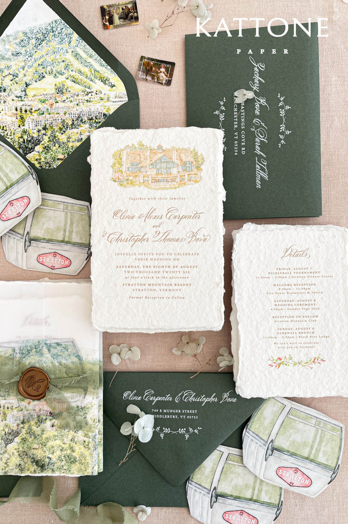 Luxury handmade paper wedding invitation suite featuring deckled edge cotton paper, custom watercolor venue illustration, scenic vellum wrap, sage green envelopes with white ink addressing, and coordinated watercolor stationery details.