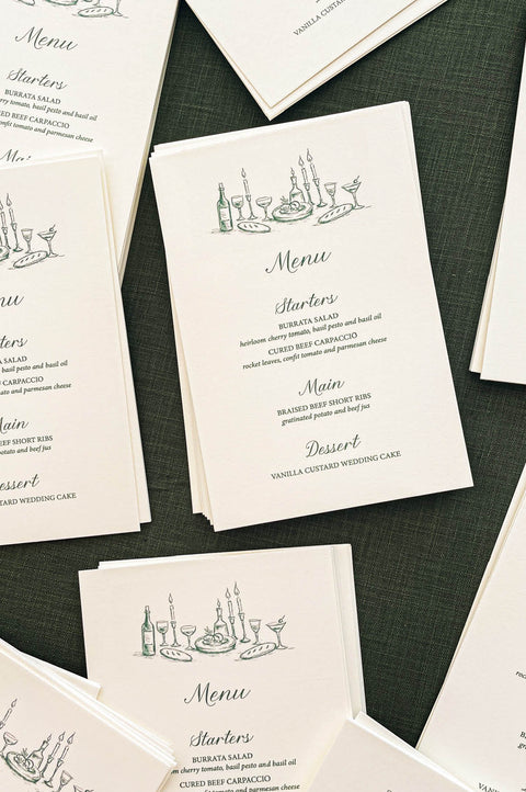 Stack of wedding menus showcasing uniform printing, clean edges and cohesive design.