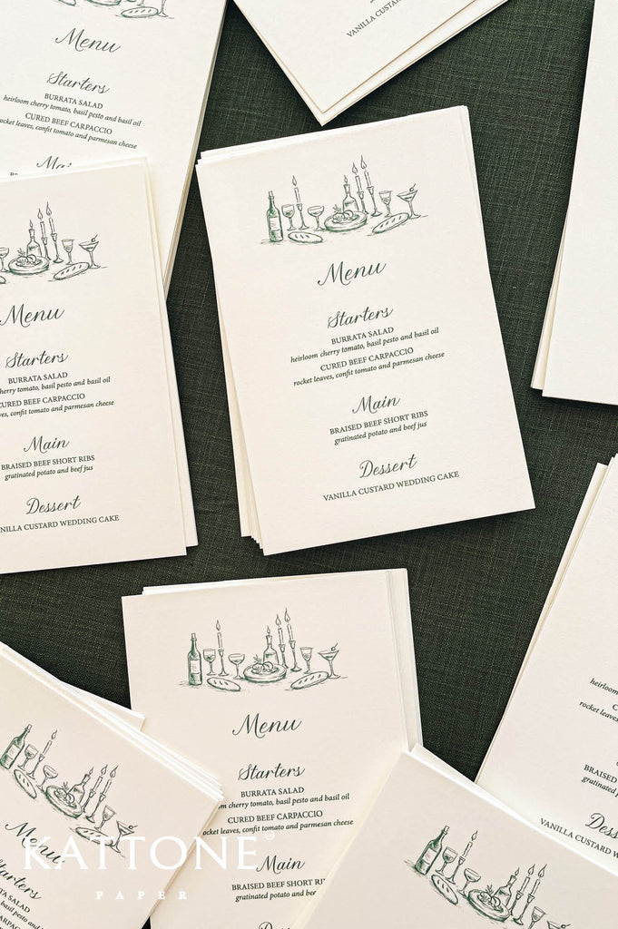 Stack of wedding menus showcasing uniform printing, clean edges and cohesive design.