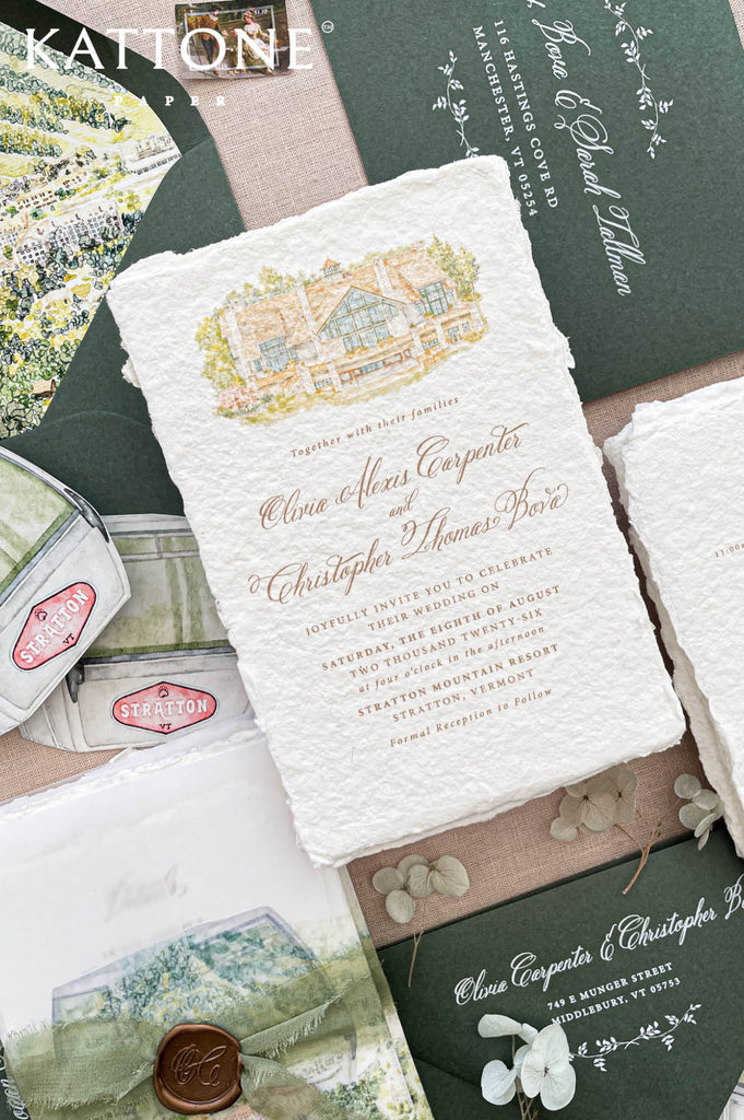 Luxury wedding stationery featuring a personalized watercolor venue illustration printed on handmade cotton paper, showcasing architectural details in warm earthy tones with soft green landscape accents.
