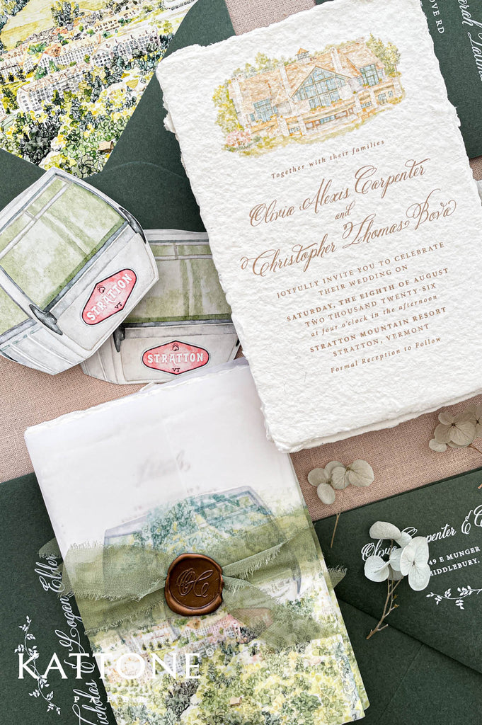 Premium handmade paper wedding invitation suite with custom watercolor venue illustration, scenic vellum wraps, deckled edge cotton paper, sage green envelopes, wax seal accents, and fine art stationery details for elegant destination weddings.