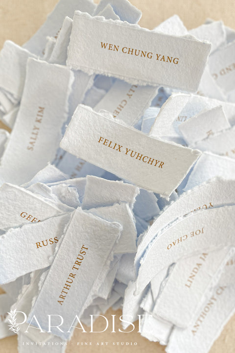 Bring refined elegance to your event with our colored handmade paper place cards, crafted from luxurious cotton rag paper and finished with naturally torn deckled edges. Each card is printed with crisp, minimalist lettering in a warm metallic tone - perfect for weddings, rehearsal dinners, corporate events, or fine-art celebrations. Their soft, muted shades add depth, texture, and a sophisticated touch to any tablescape.