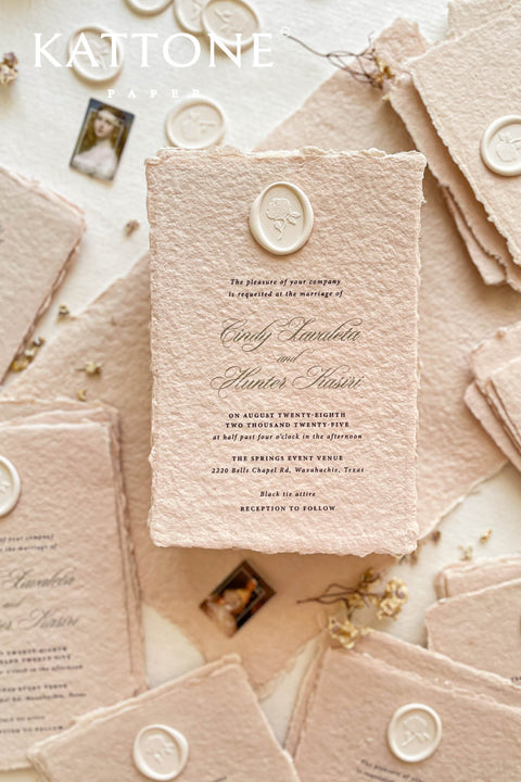 Elevate your wedding with our exquisite Handmade Paper Wedding Invitations featuring beautiful deckled edges. Crafted with love and attention to detail, these elegant invitations are tied together with luxurious silk ribbon, adding a touch of sophistication to your special day. Each piece is uniquely handmade, ensuring your announcements are as one-of-a-kind as your love story. 