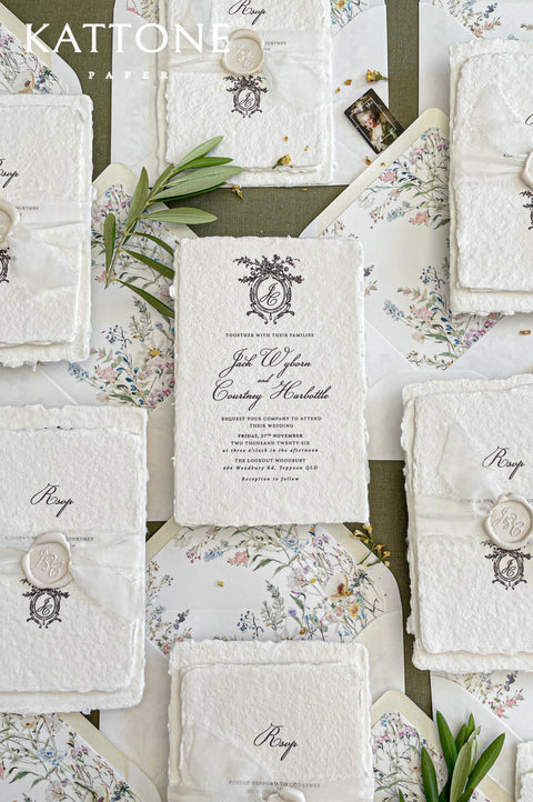 Fine art wedding invitation suite styled with handmade paper invitations, RSVP and details cards, botanical liners and neutral styling.