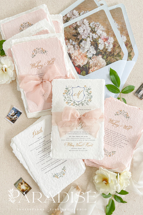 Announce your love story with timeless artistry through our handmade watercolor floral crest wedding invitations, where classic design meets modern elegance. Each invitation is crafted by hand and features a beautifully painted watercolor crest of delicate florals, personalized with your initials - a true symbol of your union.