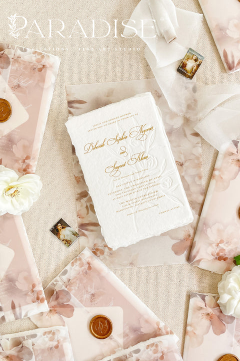 This exquisite wedding invites suite offers a blend of natural texture and romantic charm, perfect for an autumn wedding. Each piece is beautifully embossed with a delicate botanical design onto luxurious deckle edge cotton rag paper, providing a rich, tactile feel. The result is a truly romantic botanical wedding stationery set that captures the warm, earthy tones and intimate feel of the season.