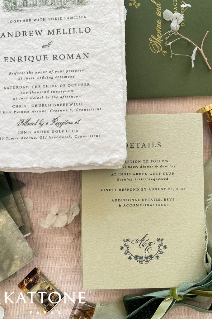 Handmade cotton paper wedding invitation with naturally deckled edges featuring elegant serif typography and a delicate green church illustration at the top, paired with coordinating luxury stationery pieces.