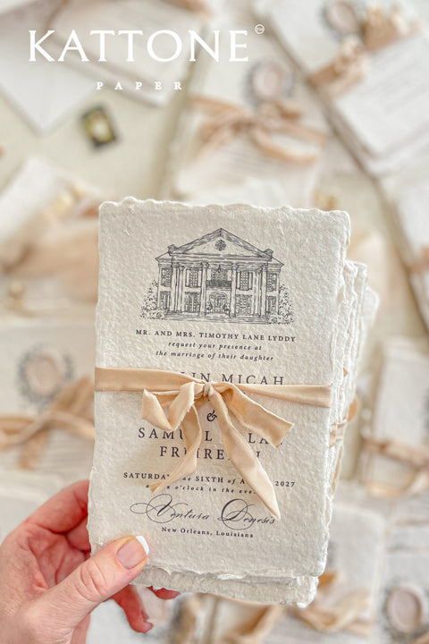 Invite your guests to your special day with the artful and personal charm of these custom wedding invitations. The unique suite features a beautiful, custom venue illustration sketch, hand-drawn by us to capture the essence of your wedding location. Designed with a light summer breeze theme and a boho chic aesthetic, this wedding stationery sets a warm, relaxed, and intimate tone for your upcoming celebration.