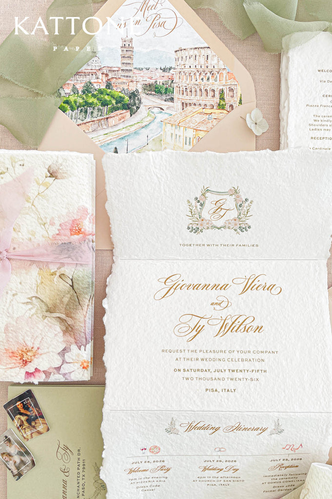 Premium concertina-style handmade wedding invitation suite with floral artwork, deckled edge cotton paper, vellum wraps and blush ribbon accents for elegant romantic weddings.