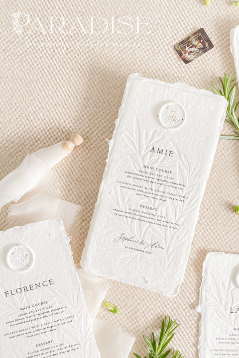 Elevate your wedding tablescape with our embossed handmade paper wedding menus, thoughtfully designed for couples seeking timeless sophistication. Crafted from 100% cotton rag paper with deckled edges and a delicate embossed botanical motif, each menu exudes fine-art elegance. The addition of a wax seal with hand-painted floral accents completes the romantic, artisanal look.