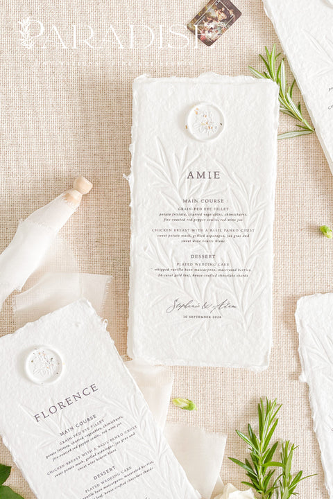 Elevate your wedding tablescape with our embossed handmade paper wedding menus, thoughtfully designed for couples seeking timeless sophistication. Crafted from 100% cotton rag paper with deckled edges and a delicate embossed botanical motif, each menu exudes fine-art elegance. The addition of a wax seal with hand-painted floral accents completes the romantic, artisanal look.