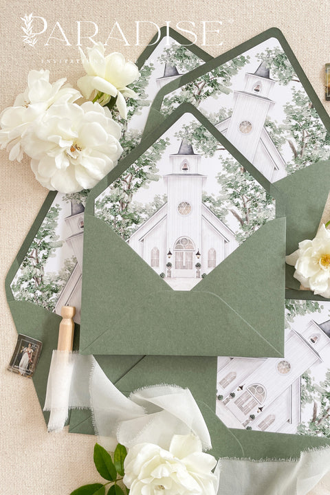Fine art wedding envelopes with illustrated chapel venue liners designed for luxury wedding invitations.
