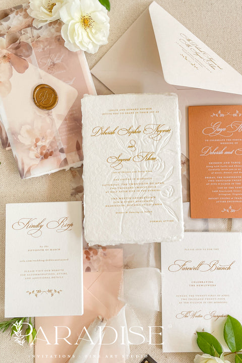 This exquisite wedding invites suite offers a blend of natural texture and romantic charm, perfect for an autumn wedding. Each piece is beautifully embossed with a delicate botanical design onto luxurious deckle edge cotton rag paper, providing a rich, tactile feel. The result is a truly romantic botanical wedding stationery set that captures the warm, earthy tones and intimate feel of the season.