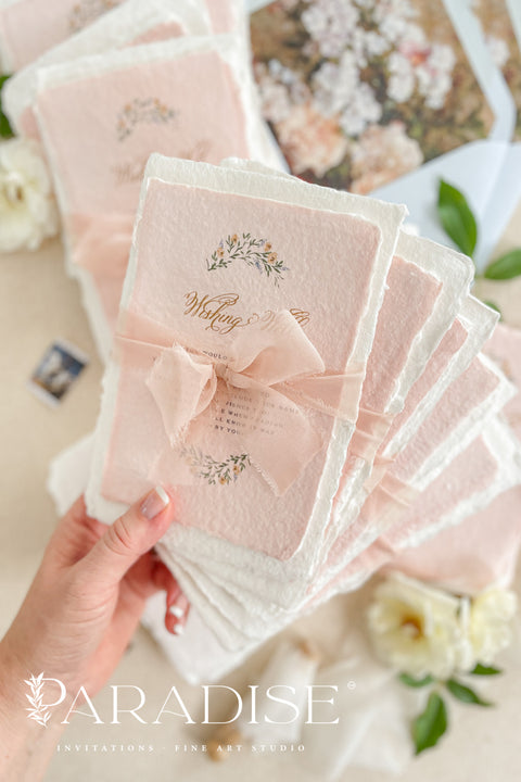 Announce your love story with timeless artistry through our handmade watercolor floral crest wedding invitations, where classic design meets modern elegance. Each invitation is crafted by hand and features a beautifully painted watercolor crest of delicate florals, personalized with your initials - a true symbol of your union.