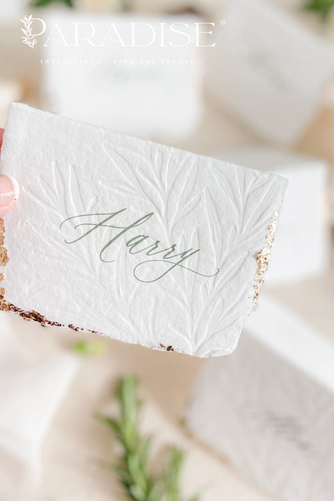 Elevate your table setting with our embossed handmade paper place cards - a luxurious detail for weddings, bridal showers, and upscale events. Each card is crafted from premium cotton rag paper, featuring a soft deckled edge, botanical embossing, and elegant calligraphy. Perfect for seating arrangements, escort cards, or personalized name tags, these artisanal pieces bring a touch of organic elegance to any celebration. 