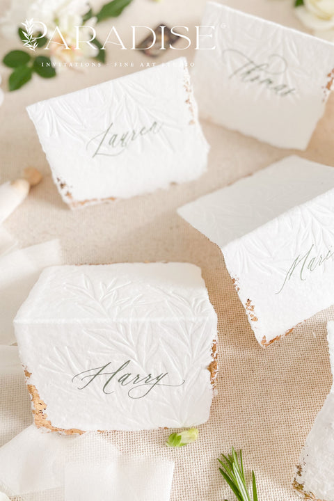 Elevate your table setting with our embossed handmade paper place cards - a luxurious detail for weddings, bridal showers, and upscale events. Each card is crafted from premium cotton rag paper, featuring a soft deckled edge, botanical embossing, and elegant calligraphy. Perfect for seating arrangements, escort cards, or personalized name tags, these artisanal pieces bring a touch of organic elegance to any celebration. 