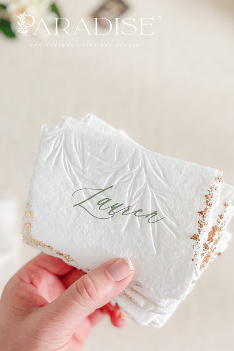 Elevate your table setting with our embossed handmade paper place cards - a luxurious detail for weddings, bridal showers, and upscale events. Each card is crafted from premium cotton rag paper, featuring a soft deckled edge, botanical embossing, and elegant calligraphy. Perfect for seating arrangements, escort cards, or personalized name tags, these artisanal pieces bring a touch of organic elegance to any celebration. 
