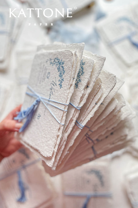 Embrace bohemian charm and natural elegance with the Juliette boho rustic stationery sets. Each handmade wedding invitation is a beautiful work of art, featuring luxurious cotton rag paper with a romantic deckle edge. To complete the bohemian feel, every suite is embellished with a delicate tassel, creating a uniquely personal and tactile experience for your guests. The combination of rustic textures and charming details makes this collection perfect for a relaxed and romantic celebration.