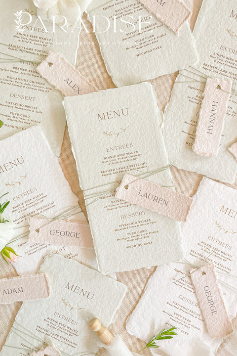 Add timeless charm and fine art elegance to your table styling with our handmade paper wedding menus, beautifully crafted from 100% cotton rag paper with naturally torn deckled edges. Each menu is adorned with a delicate name tag tied with fine thread, offering both practicality and sophistication as a combined menu and place card. The refined typography, minimal layout, and soft color palette bring a romantic yet modern touch, making these menus the perfect complement to luxury weddings, rehearsal dinners.