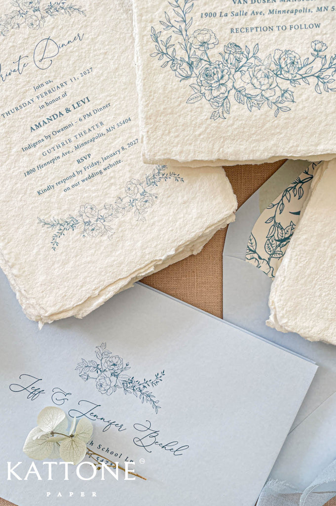 Luxury wedding stationery featuring delicate hand-drawn floral illustrations in soft dusty blue for a timeless garden-inspired aesthetic.
