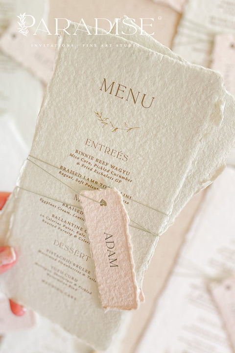 Add timeless charm and fine art elegance to your table styling with our handmade paper wedding menus, beautifully crafted from 100% cotton rag paper with naturally torn deckled edges. Each menu is adorned with a delicate name tag tied with fine thread, offering both practicality and sophistication as a combined menu and place card. The refined typography, minimal layout, and soft color palette bring a romantic yet modern touch, making these menus the perfect complement to luxury weddings, rehearsal dinners.